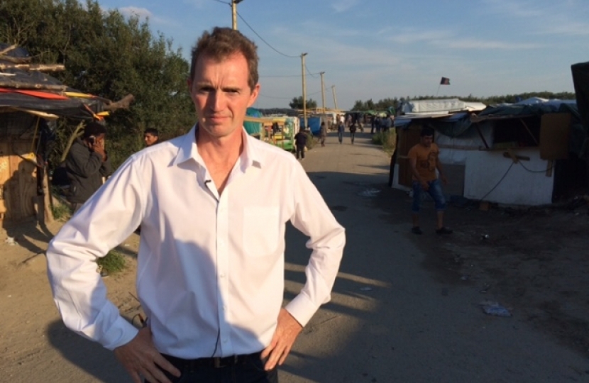David during a visit to the Calais migrant camp