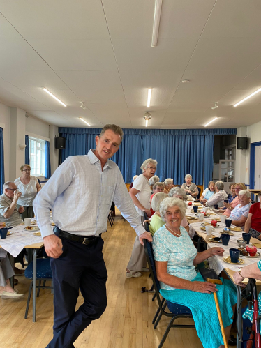 David TC Davies MP with residents of Goytre at the wellbeing café