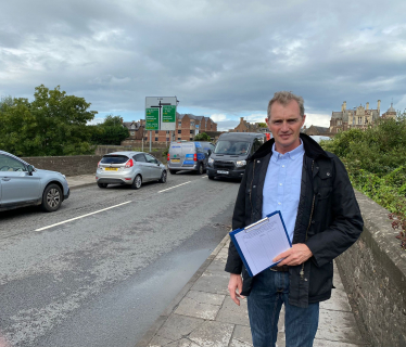 David TC Davies MP on Wye Bridge before assisting with the community-led petition