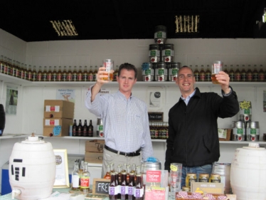Raising a glass are David Davies MP and Alex Culpin, sales director at Ty Gwyn